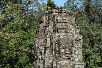 Fototapeta premium Beautiful face sculptures at the famous Bayon temple in the Angkor Thom temple complex, Siem Reap, Cambodia
