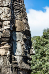 Beautiful face sculptures at the famous Bayon temple in the Angkor Thom temple complex, Siem Reap, Cambodia