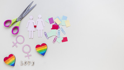 Love inscription with lesbian couple icons and rainbow hearts