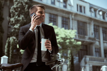 Businessman with bicycle