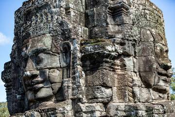 Beautiful face sculptures at the famous Bayon temple in the Angkor Thom temple complex, Siem Reap, Cambodia