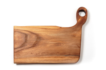 Wooden cutting board on a light background