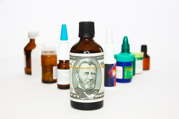 dollar on a bottle of medicine on the background of medical drugs