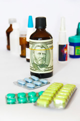 dollar on a bottle of medicine on the background of medical drugs