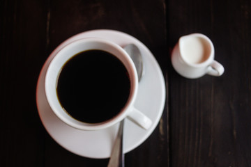beautiful stylish stunning white cups with coffee and milk on a wooden table