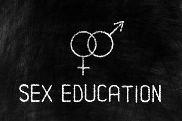 Sex Education Chalk Writing with Sign on Grunge Chalkboard Background.