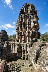 Beautiful face sculptures at the famous Bayon temple in the Angkor Thom temple complex, Siem Reap, Cambodia