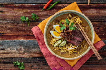 Malaysia Spicy Noodle Mee Rebus With Beef Egg and fried onion, copy space