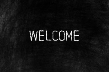 Welcome on Black Chalkboard Background, Suitable for Business Concept.