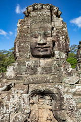 Fototapeta premium Beautiful face sculptures at the famous Bayon temple in the Angkor Thom temple complex, Siem Reap, Cambodia