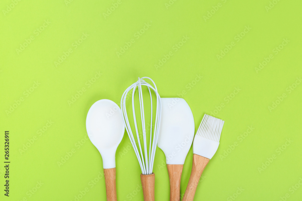 Wall mural different kitchenware on a colored background top view. Cooking appliances.