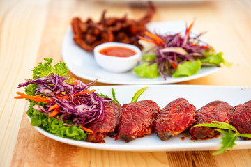 Grilled pork topped with sauce