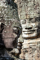 Beautiful face sculptures at the famous Bayon temple in the Angkor Thom temple complex, Siem Reap, Cambodia