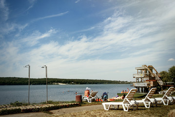 amazing beautiful landscape of beach with white chairs, summer travel concept