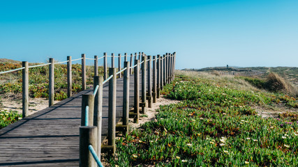 Wooden boardwalk at the Praia da Frente Azul, in english the blue beach front in the seaside resort Espinho