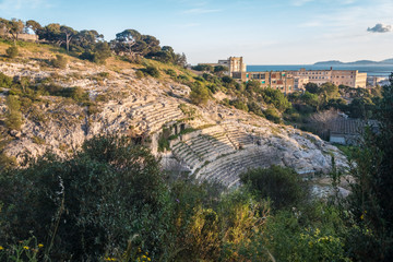 Fototapeta na wymiar The Roman Amphitheatre of Cagliari, Sardinia, Italy. Built in the 2nd century AD, half carved in the rock of a hill.