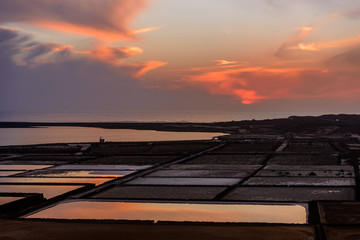 Naklejka na ściany i meble Sunset at Salinas de Janubio. Old salt pans in the south of Lanzarote were they harvest salt the traditional way