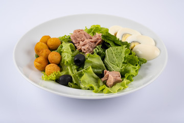 tuna with salad. Salad with tuna, cheese fries, eggs, olives