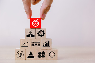 Hand Closer up hands of businessmen,stacking wooden blocks into steps,Concept of business growth success