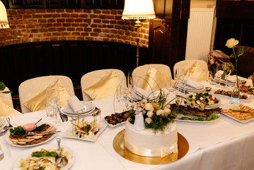 luxury decorated tables for wedding reception, catering in restaurant