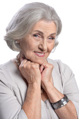 Beautiful senior woman posing isolated on white background