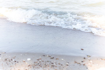 Sand background copy space for text. Sea beach and soft wave.