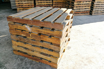 Stack of wooden pallets at warehouse. Transportation logistic business.