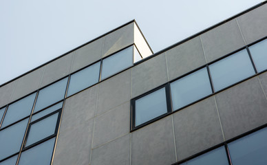 large gray concrete structure with empty windows