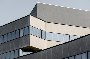 Fototapeta na wymiar tall large gray concrete building with empty windows