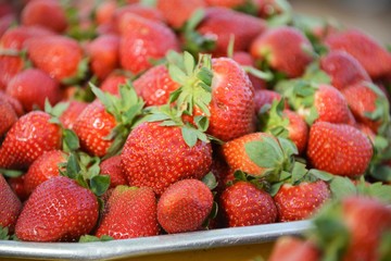 A dish containing strawberries