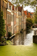 Canal and bridges in Delft, Holland. View on the beautiful old buildings and water channel in Delft town