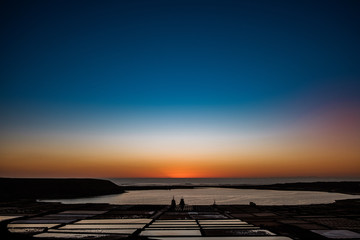 Fototapeta na wymiar Sunset at Salinas de Janubio. Old salt pans in the south of Lanzarote were they harvest salt the traditional way