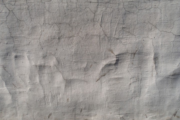 Old plaster with cracks and bumps
