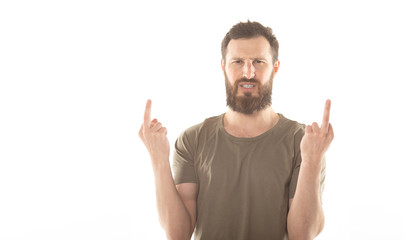 Fototapeta premium Young angry handsome man Showing middle finger.