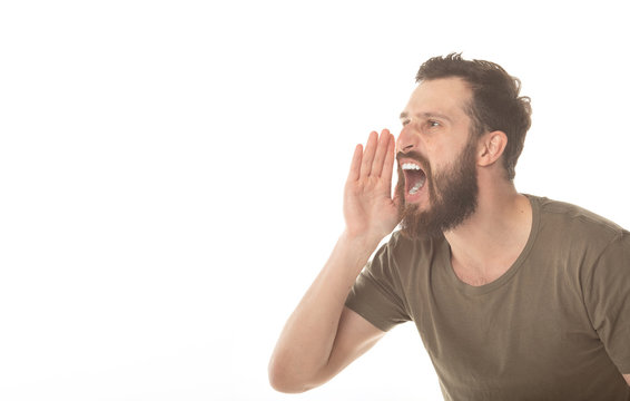 Side View Of An Angry Bearded Man Shouting Isolated On White Background 