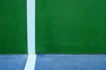 Fototapeta premium Close up White Line of Green Tennis Training Wall Background.