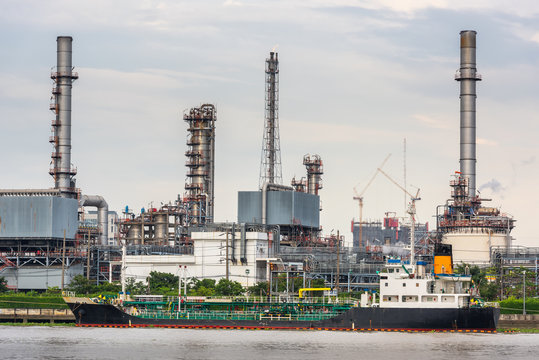 Landscape Of Oil Refinery Plant And Manufacturing Petrochemical At Twilight Sunset Scenic View,Industry Of Power Energy And Chemical Petroleum Product Factory. Logistics Transportation