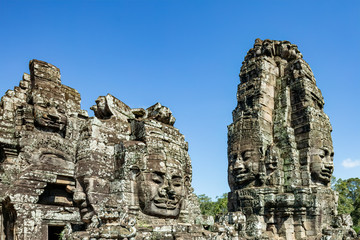 Beautiful face sculptures at the famous Bayon temple in the Angkor Thom temple complex, Siem Reap, Cambodia