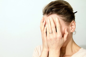 Fototapeta premium woman with headache on white background stock image and stock photo