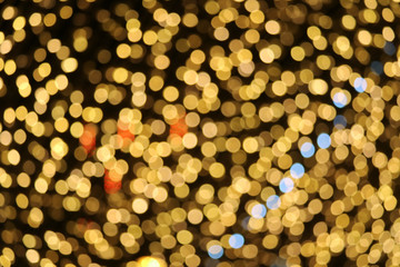 gold color abstract of blur and bokeh colorful light and night garden