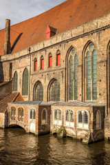 Beautiful view of medieval architecture and canal near the Beguinage (Begijnhof) in Bruges (Brugge)
