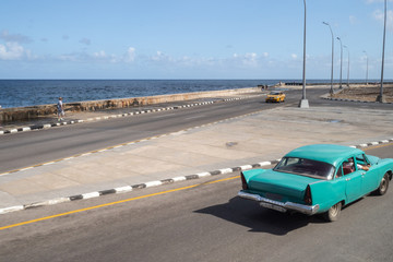 Vintage car driving down the Malecon, Havana, CUBA