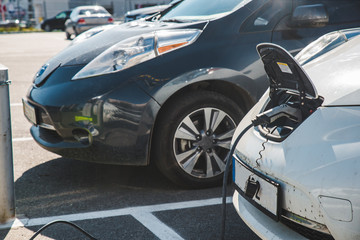 Fototapeta na wymiar electric car charging at mall parking aria