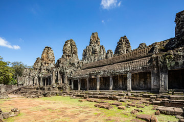 Beautiful face sculptures at the famous Bayon temple in the Angkor Thom temple complex, Siem Reap, Cambodia