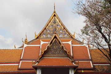 roofs of buildings in a buddhist temple (wat mahathat) in bangkok (thailand)