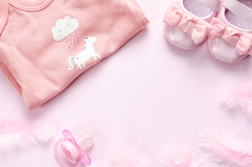 Baby pink accessories on pink background. 