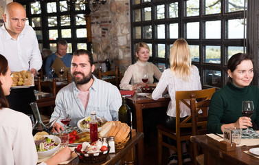 Fototapeta na wymiar Rustic restaurant with diners people