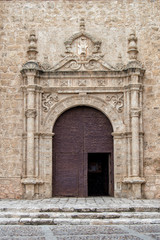 Fototapeta na wymiar Renaissance door of the church of the Holy Sacrament in Torrijos, province of Toledo. Castilla la Mancha. Spain