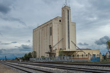 Fototapeta na wymiar Grain silos next to the railroad. Spain
