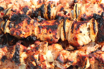Barbecue skewers with juicy appetizing delicious meat closeup